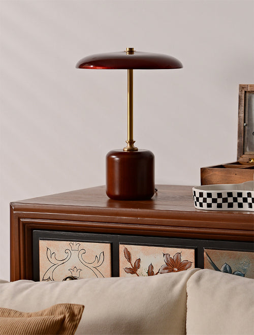 American MCM Table lamp with a wooden base on a wooden surface with decorative elements.