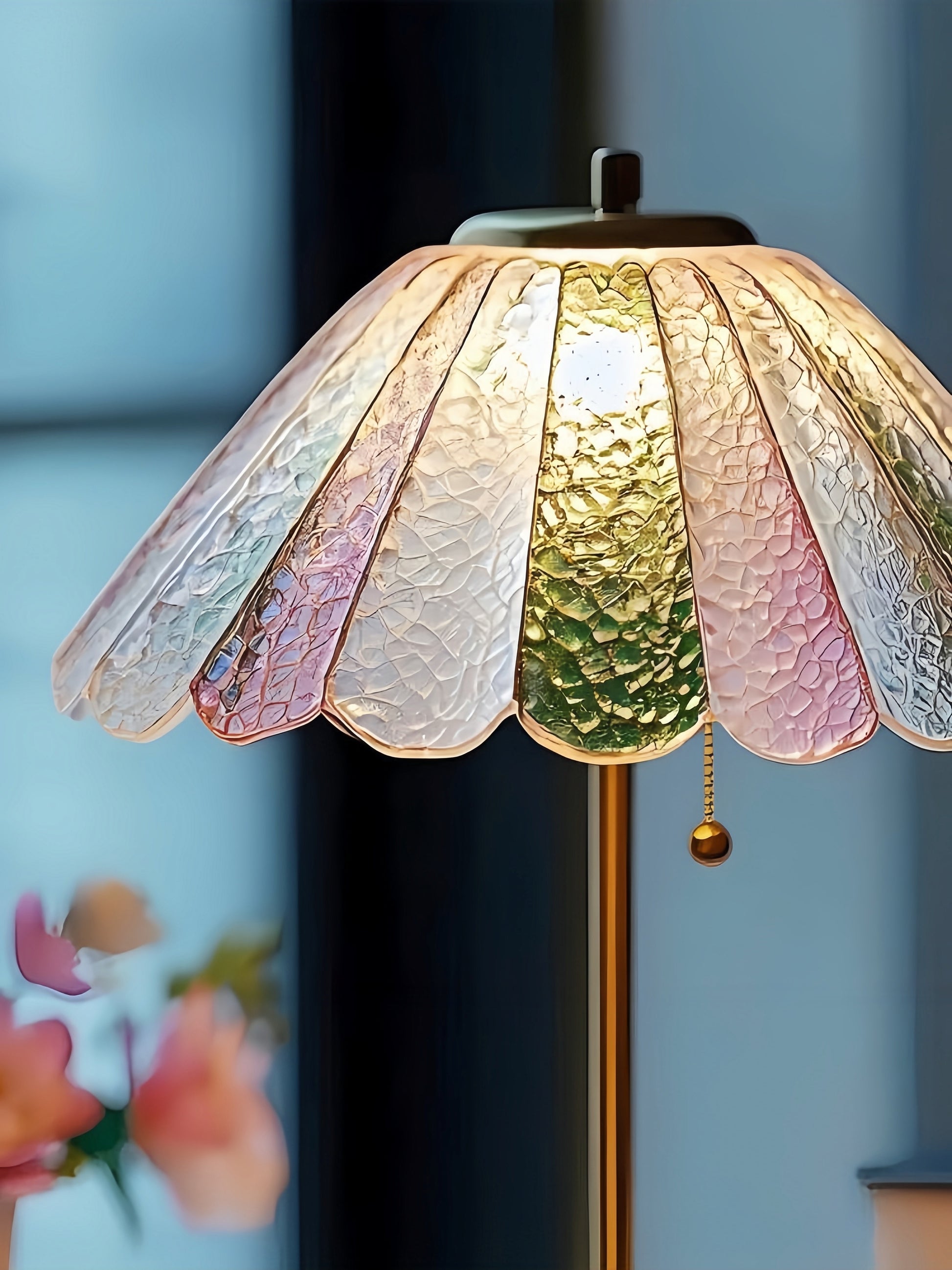 Decorative colorful MCM lamp with a colorful glass shade against a blurred background