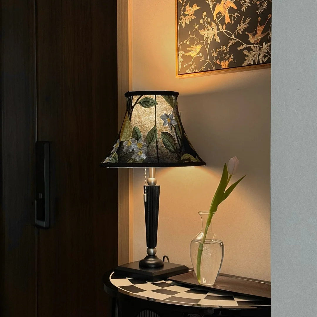 French Style Lemon Embroidery Table Lamp casting warm light in a decorative eclecticism living room corner