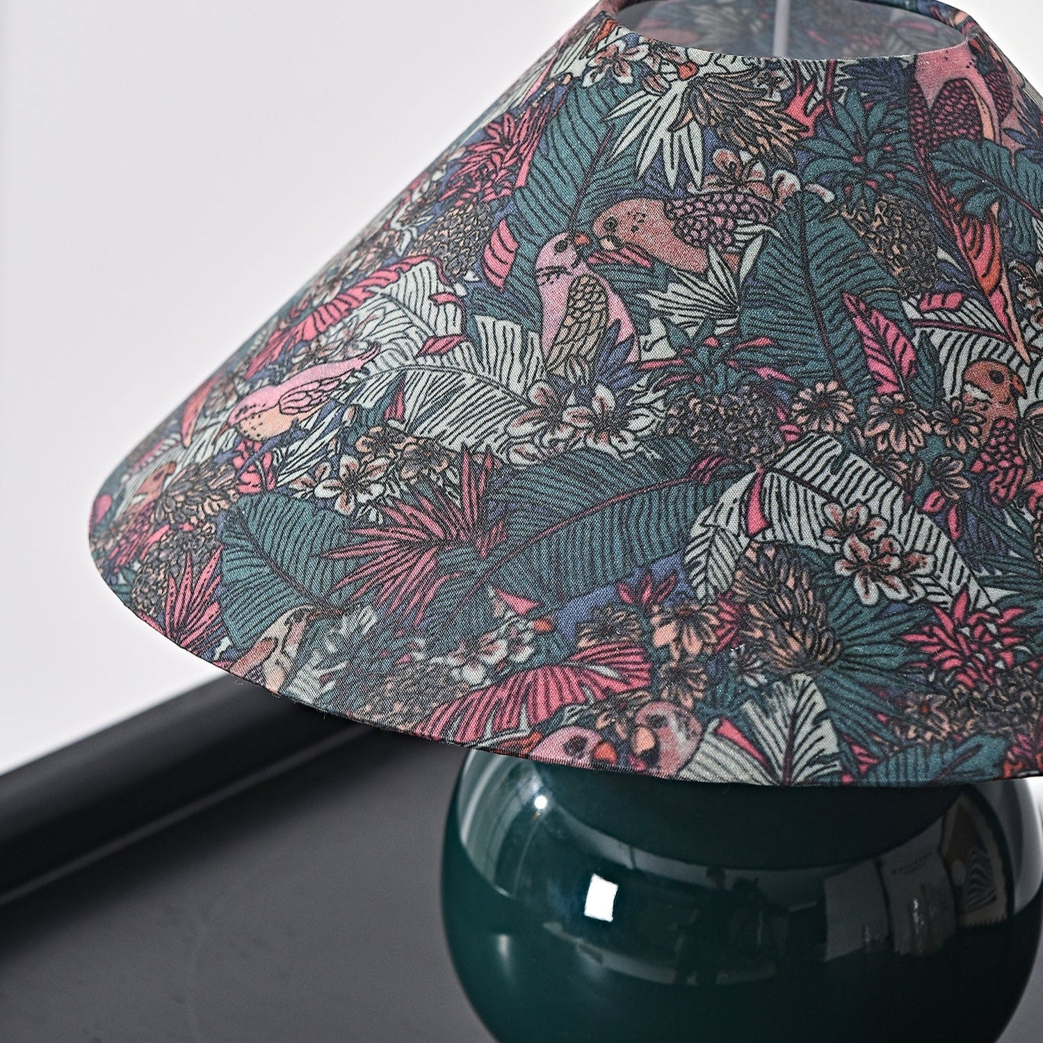 Close-up perspective revealing ceramic base craftsmanship and linen shade seams