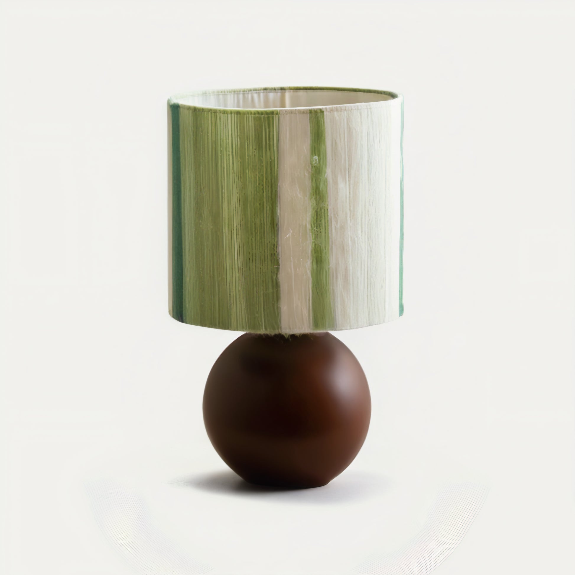 Artisan mohair table lamp with a green and brown design on a white background