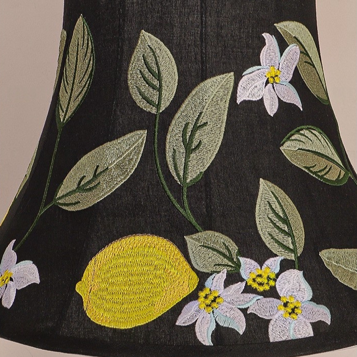 Close-up detail of delicate handcraft lemon embroidery pattern on silk lampshade