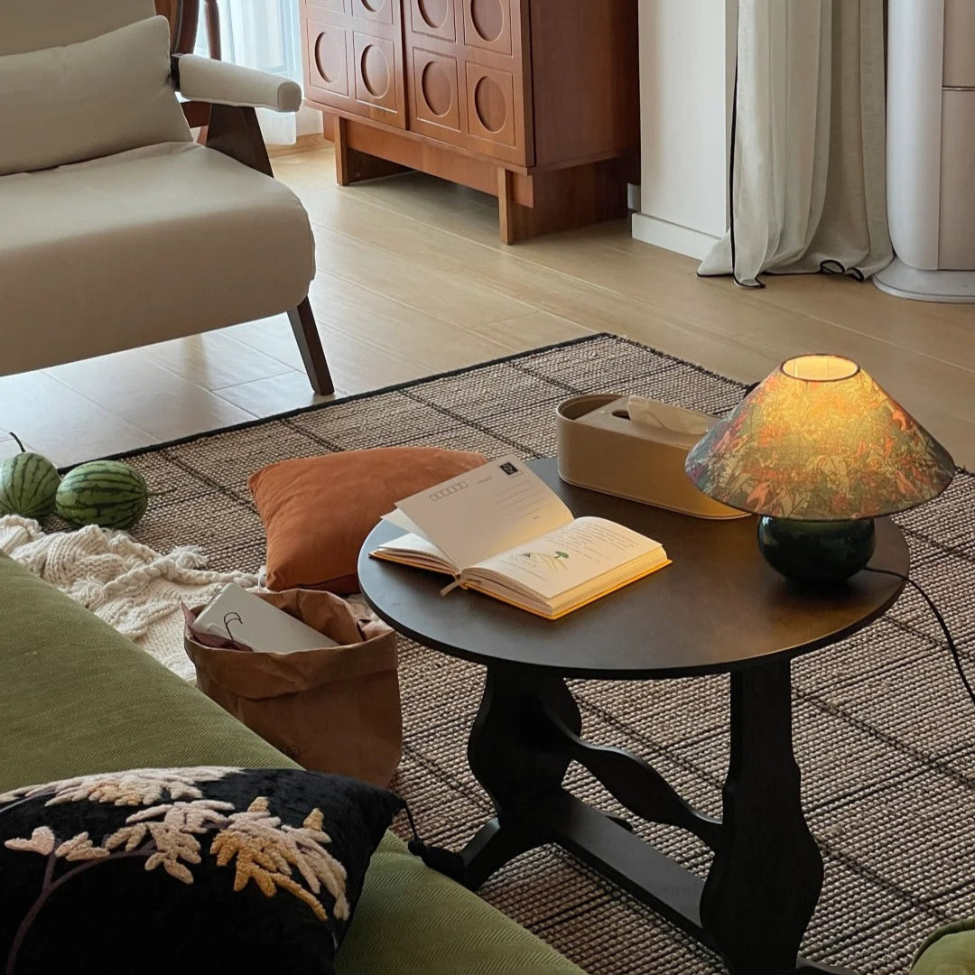 lluminated retro desk lamp casting warm ambient light in dim living room settings